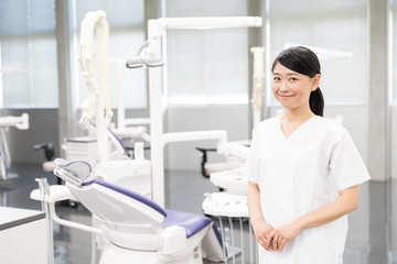 portrait of asian dentist in dental clinic
