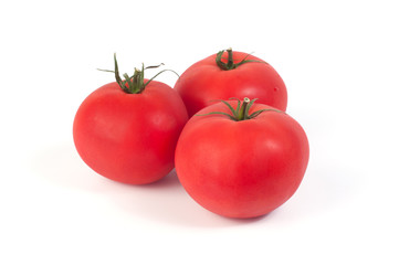 Fresh three tomatoes on a white background