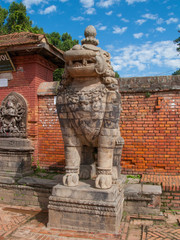 KATHMANDU, BHAKTAPUR, NEPAL.  Ancient stone lion in the Durbar square in Bhaktapur.