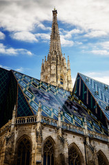 Fototapeta premium The cathedral of Vienna (Stephandsdom) dedicated to Saint Stephen, with its glazed tiles roof and the dome spire