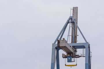 Container crane against blue sky