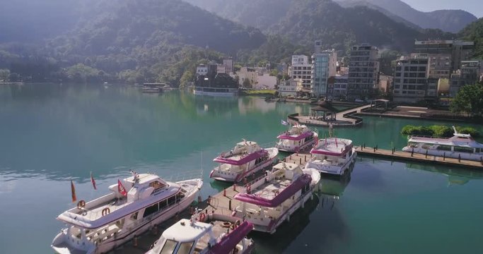 Aerial shot of Ita Thao Pier with boats aside, Sun Moon Lake, Taiwan 