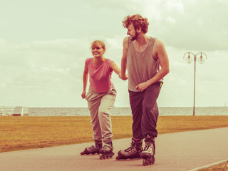 roller skater couple skating outdoor