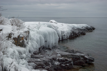 frozen outcropping on lake - 164222462
