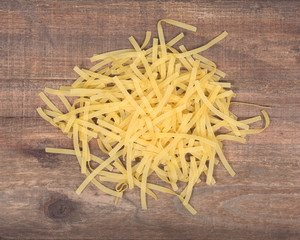 Healthy pasta, home made noodles on vintage wooden tray