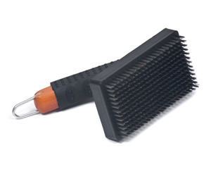 Grill brush with metal bristles isolated on white background