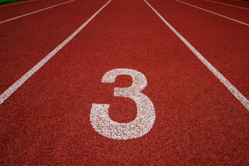 Red running track Synthetic rubber on the athletic stadium.