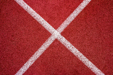 Fototapeta na wymiar Red running track Synthetic rubber on the athletic stadium.