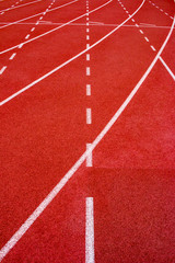Red running track Synthetic rubber on the athletic stadium.