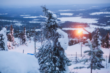 Beautiful cold mountain view of ski resort, sunny winter day with slope, piste and ski lift

