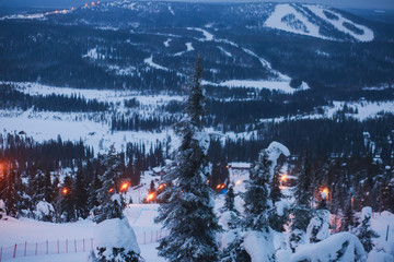 Beautiful cold mountain view of ski resort, sunny winter day with slope, piste and ski lift
