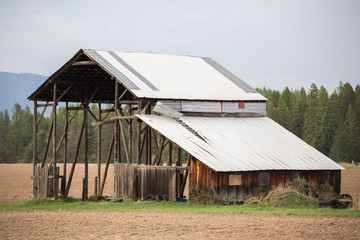 Old Barn Building with Windblown Roof