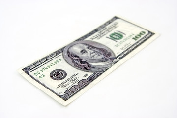 Shallow focus one hundred dollar bill. Isolated.