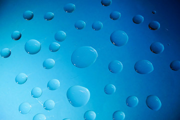 Water Drops On Blue Background.