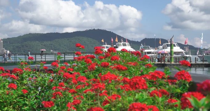 Panning right to tourists on boat at Ita Thao Pier, Sun Moon Lake, Taiwan 