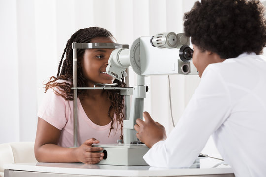 Female Optometrist Examining Patient
