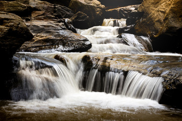 Fototapeta premium small waterfall among rocks