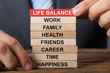 Businessman Building Life Balance Concept With Wooden Blocks