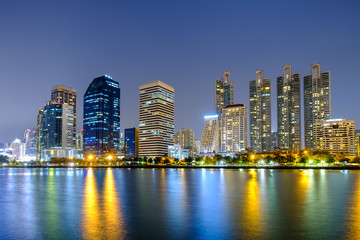 Naklejka na ściany i meble Asoke modern buildings of Bangkok night city skyline, Thailand.