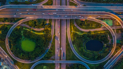 Bangkok Expressway top view, Top view over the highway, expressway and motorway at night, Aerial view interchange of a city, Shot from drone, Expressway is an important infrastructure in Thailand