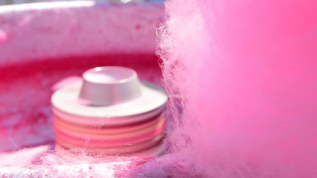 Working cotton candy machine-producing cotton candy
