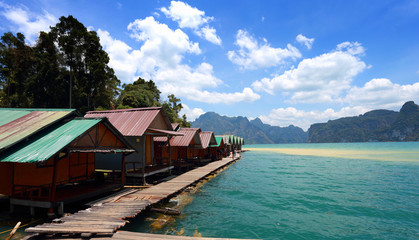 Fototapeta na wymiar Beautiful mountains and river natural attractions in Ratchaprapha Dam at Khao Sok National Park, Surat Thani Province, Thailand.