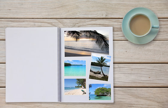 Photobook Album on Deck Table with Travel Photos and Coffee or Tea in Cup
