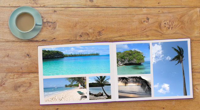 Banner Photobook Album with Travel Photo on Wooden Table background  and Coffee or Tea in Cup
