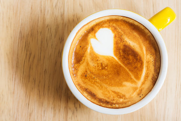 Coffee cup on wood table.