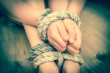 Kidnapped woman tied with rope