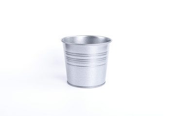 A tin flower pot isolated on white background.