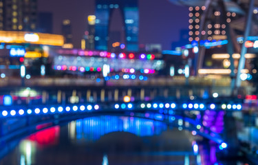 Abstract bright multicolored lights against city skyline.