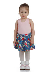 Cheerful little girl on white background isolated, vertical frame.