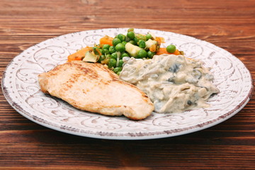 Turkey fillet with mushrooms in cream sauce and vegetables