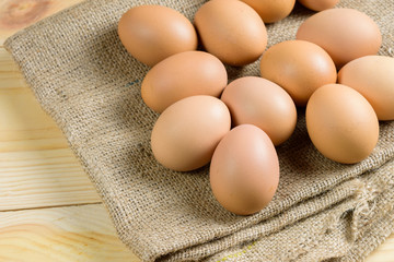 Pile of raw eggs on hemp sack