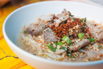 Thai food noodles with pork soup in a bowl.