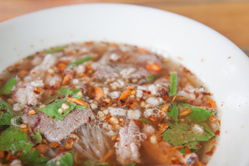 Thai food noodles with pork soup in a bowl.