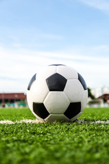 Fototapeta na wymiar Soccer Football on the green grass of Soccer field.