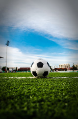 Soccer Football on the green grass of Soccer field.