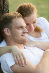 Fototapeta premium Romantic couple embracing in park