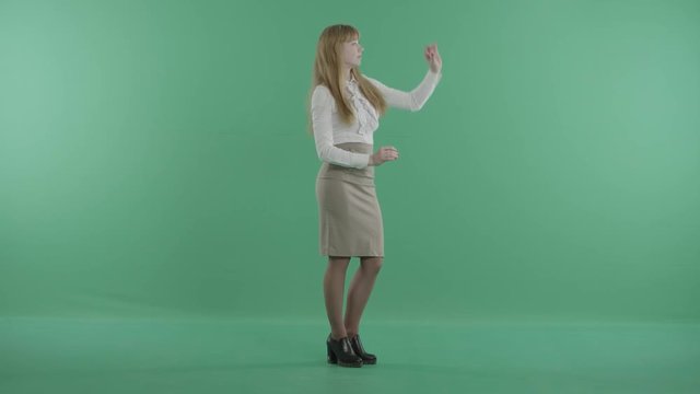 a redhead woman works with a digital projection