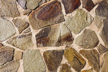 Texture of a surface from a multicolored wet sandstone