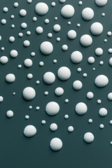 White drops on smooth surface, abstract background
