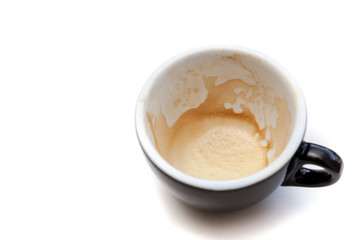 Stain of coffee in black cup on white background isolated