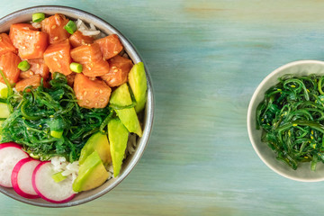 Hawaiian salmon poke salad with wakame and copy space