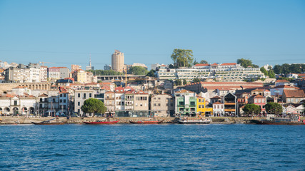 Fototapeta na wymiar Porto, Oporto, in Portugal, view of the Douro, boats and cable car