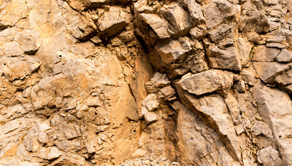 Naklejka na ściany i meble Stone cliffs in the mountains as a background
