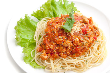 Spaghetti meat sauce ready to serve on white plate, on white background isolated