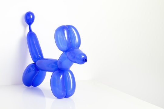 Simple Blue Twisted Balloon Animal Dog On White. Toy Of Balloons, Free Space For Text. Balloon Art.