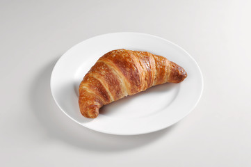 Dish with a croissant